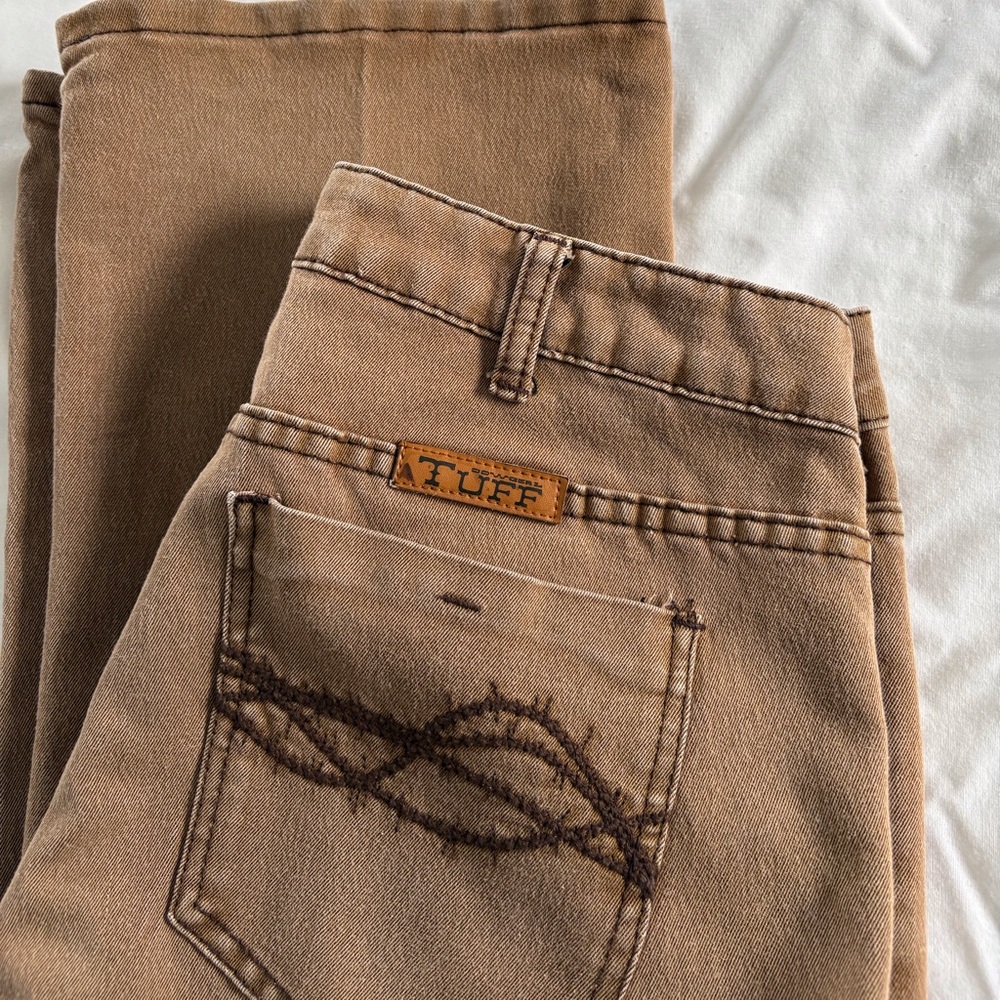 Comfortable Cowgirl Tuff, dark tan jeans, brown barbwire stitching, coin pocket